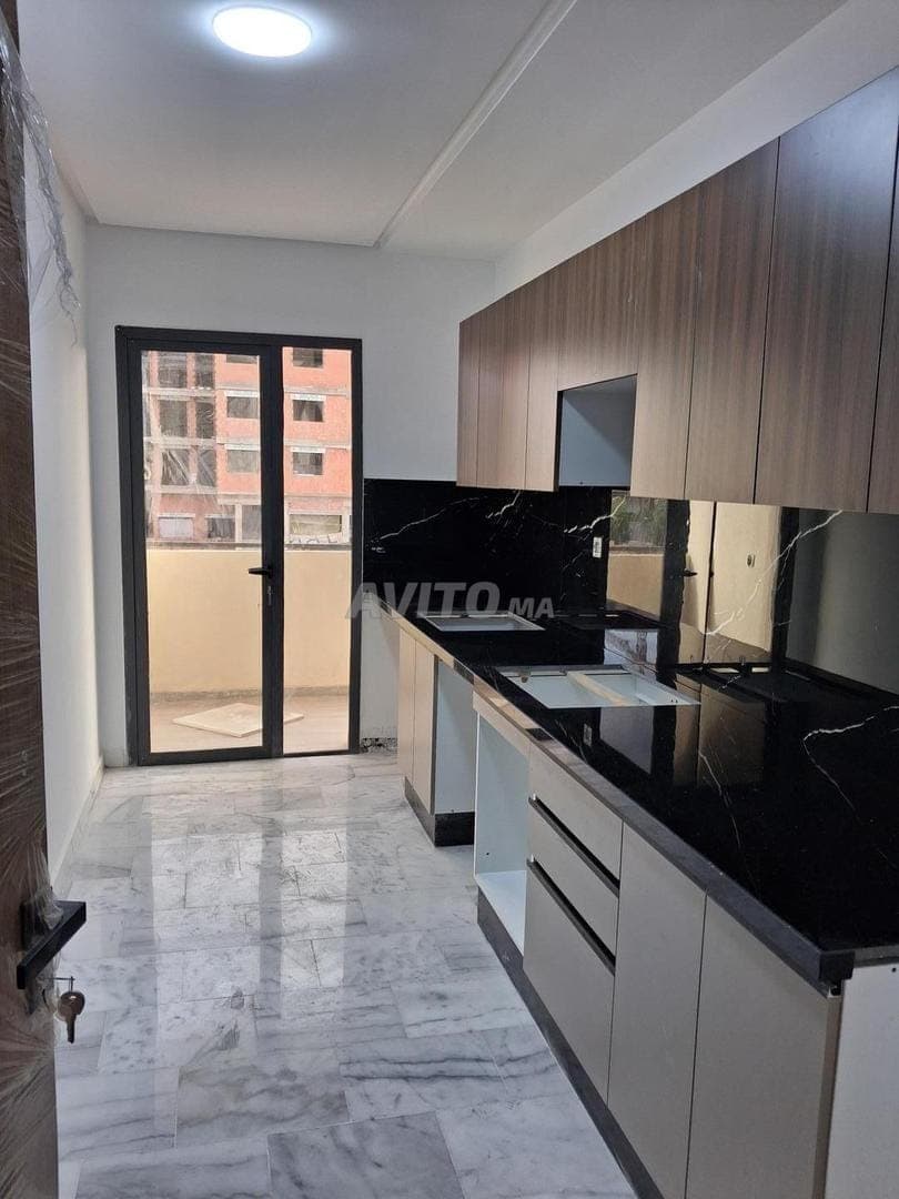 Appartement à louer 77m² à Victoria Bouskoura