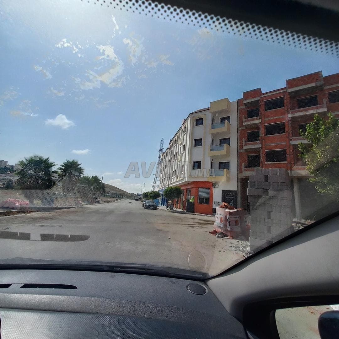 Terrain 2 façades 130 mètres garage 3 lotissement